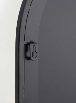 Black metal arched mirror with shelf
