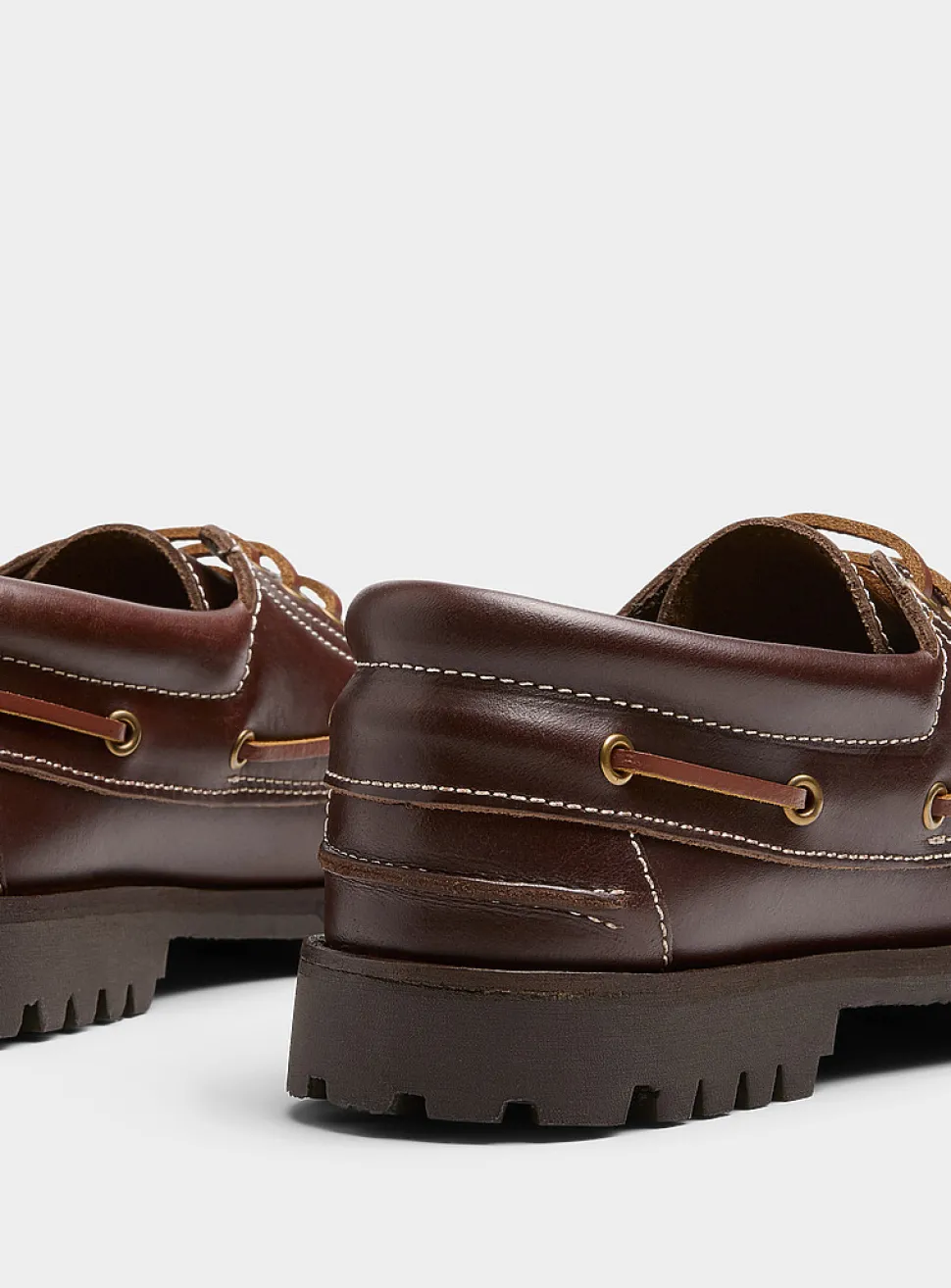 Brown leather notched boat shoes