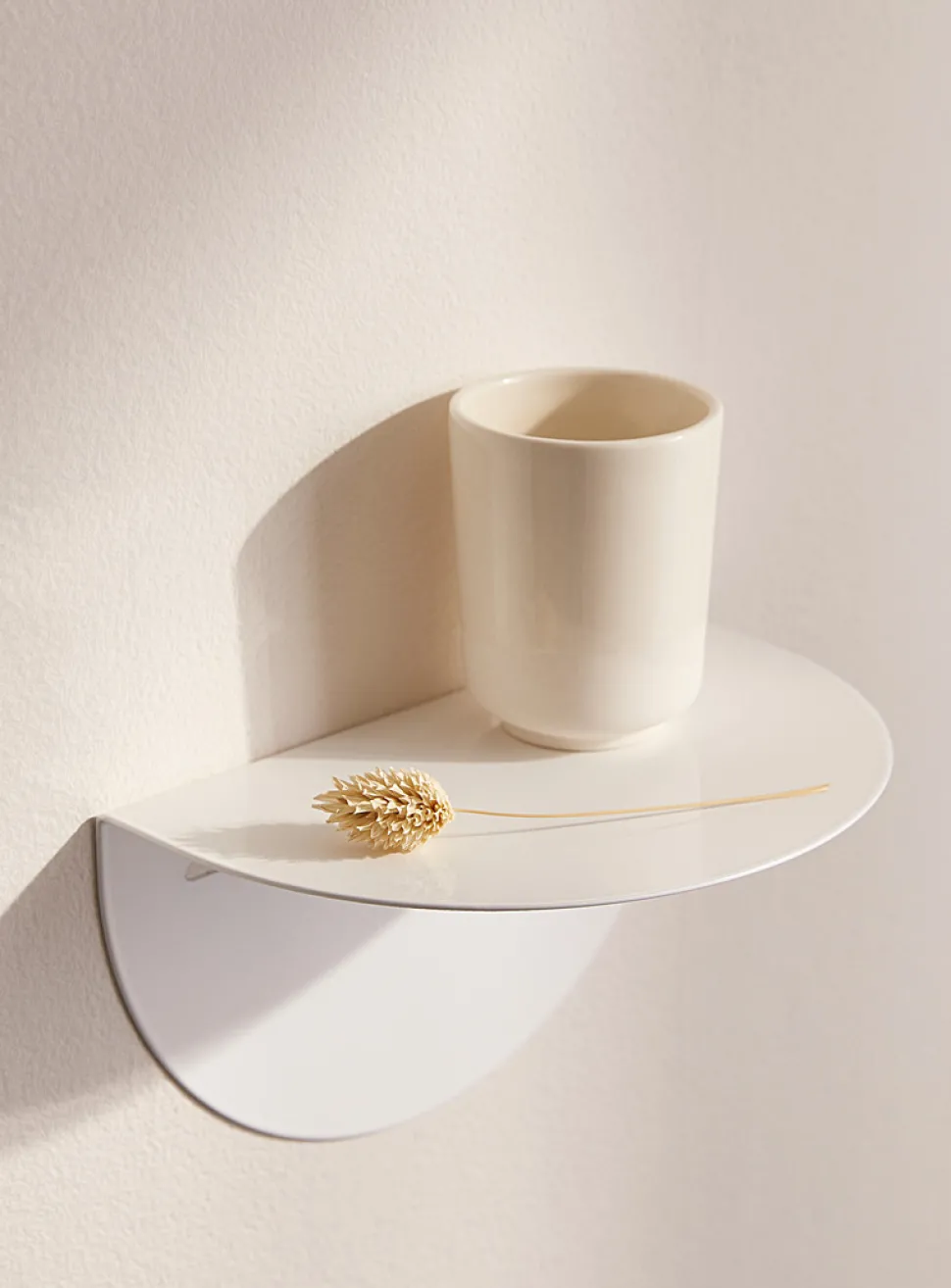 Minimalist half-moon wall shelf