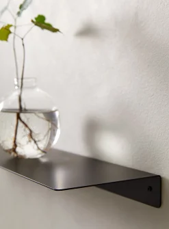 Minimalist steel wall shelf