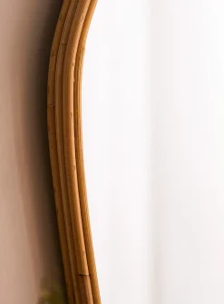 Rattan trim asymmetrical mirror