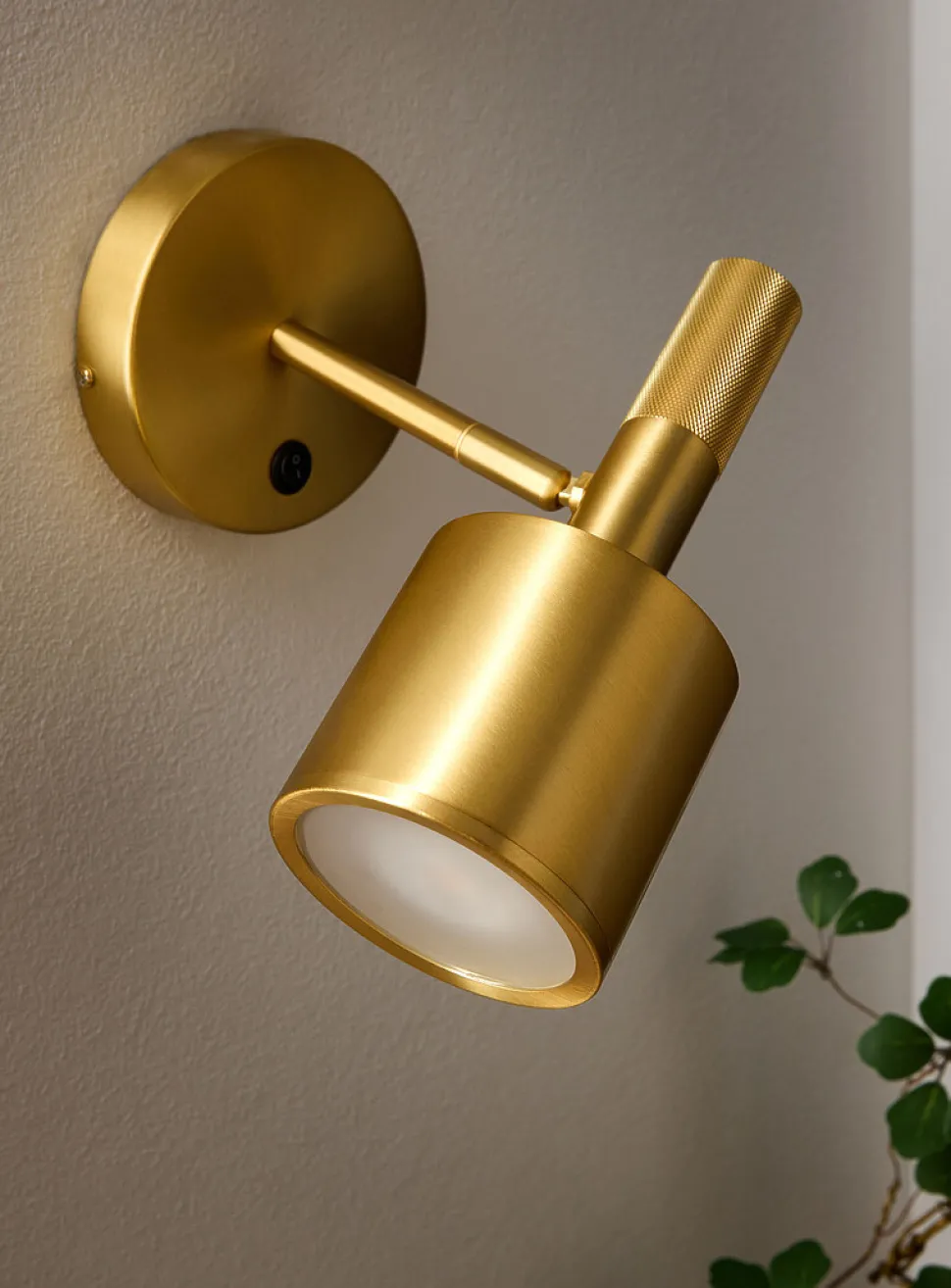 Rhoswen sleek brass finish wall sconce