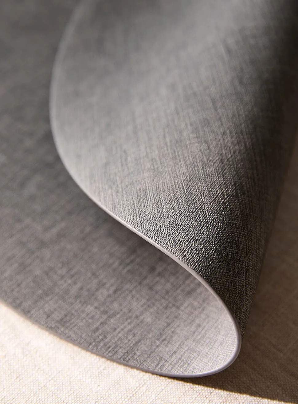 Round heathered faux-leather placemat
