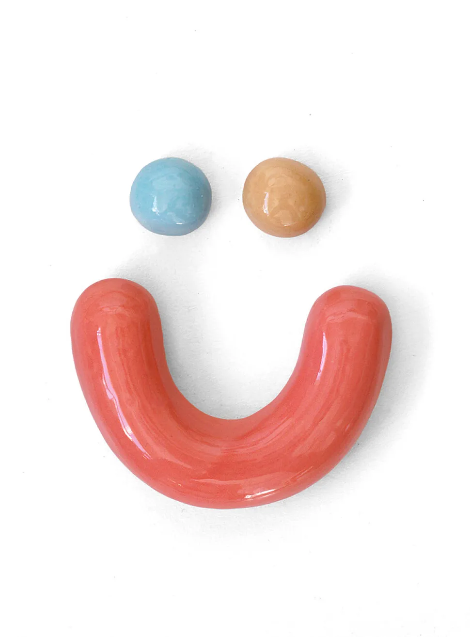 Semiporcelain smiley face wall ornament