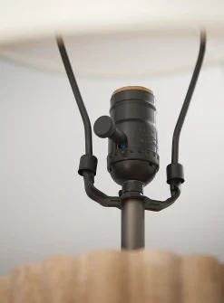 Table lamp with fluted travertine base